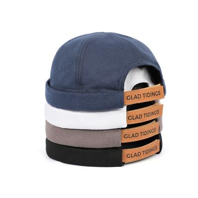 China COMMON OEM Customize 6 Panel Adult Customized Canvas Custom Logo Hook And Loop Brimless Cap for sale