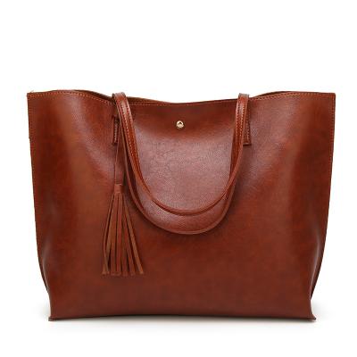 China Normcore/Minimalist oil wax fashion ladies bags girls tassel leather handbag for wholesales for sale