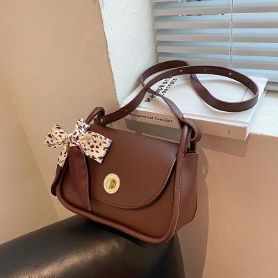 China 2021 Pu lock clamshell western style silk women's bag small cool bow shoulder messenger bag for sale