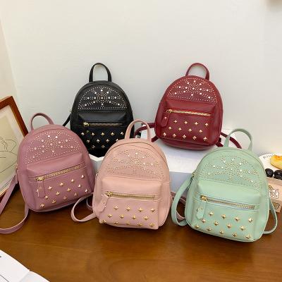 China All-match trend change anti-theft ladies shape rivet diamond casual backpack multifunctional travel mini backpack for sale