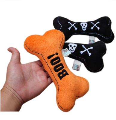 China Manufacturer Custom Wholesale Orange Viable Plush Black Dog Bone Halloween Squeaky Toys for sale