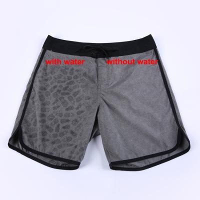 China Custom Magic Water Board Function 4 Way Mens Size Reactive Print Swim Shorts Men Plus Shorts for sale