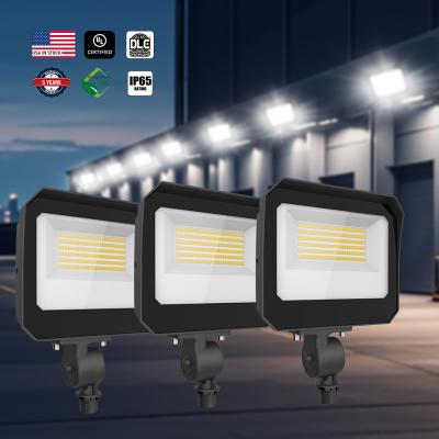 China Luz de inundación LED exterior con fotocélula de alta luminosidad 140LM/W 100W 120W 150 Watt para iluminación de fachada de estacionamiento en venta