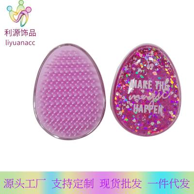 China 2021 New Eco-friendly Scalp Massage Detangling Hair Brushes Glitter Liquid Water Crystal Egg Shaped Hair Brushes for sale