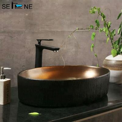 China Fashion Trend Design Metal Color Metal Cooper Shape Vessel Sink Lavatory Oval Modern Bronze Bathroom Sink for sale