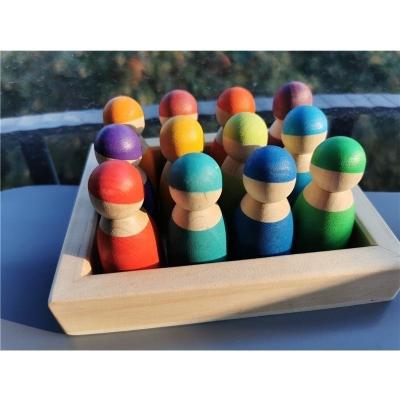 China 100% 12 Pcs Eco-Friendly Wooden Handmade Peg Dolls Friends Stacking People Rainbow Stain Figures For Kids Open Play for sale