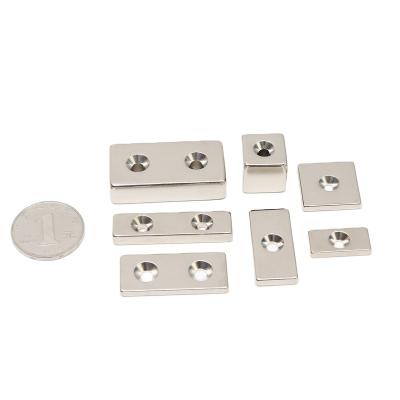 China Industrial Magnet Hole Magnets Sets One or Two Hole Neodimiumt NdFeB Magnets Permanent Square Countersunk Hole Magnets Block for sale