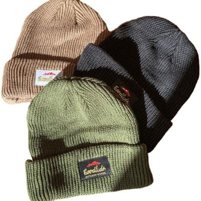 China COMMUNE Fashion Logo Woven Label Unisex Winter COMMUNE Wholesale Beanie Hat Custom Made for sale