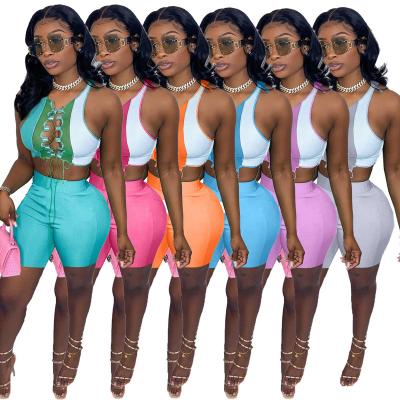 China 2022 Breathable Sexy Outfits Women Hollow Out Lace Up Crop Sleeveless Top 2 Piece Women Set Patchwork Set Women Clothing Two Piece Shorts for sale