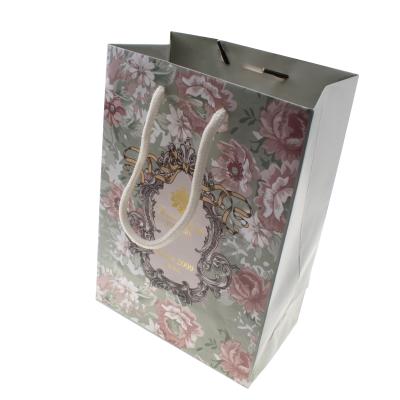 China 210g art paper recyclable eco-friendly paper bags with your style for sale