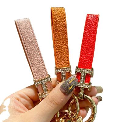 China Unpacking Diamond Belt Keychain Female Exquisite cute key chain and creative simple car key ornament for sale