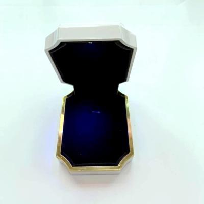 China Handmade Glossy Painting Plastic Pendant Box With LED Light for sale