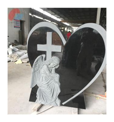 China Modern Heart Shaped Black Granite Headstone With Semi-carved Angel And Relief Cross for sale