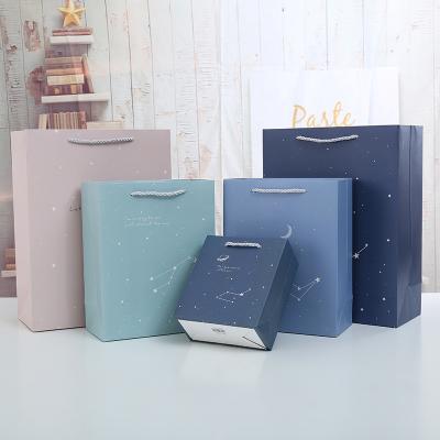 China Recyclable Starry Sky Cardboard Paper Gift Bags Tote Bag Souvenir Package Shopping Biodegradable Paper Bag for sale