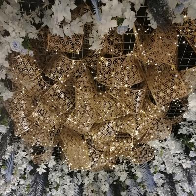 China Eco-friendly new wrought iron carved hollow spiral shape mesh print style ceiling decoration wedding site layout for sale