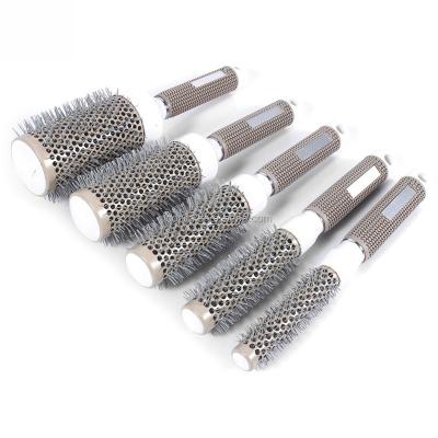 China Compact Professional Hair Dressing Brushes High Temperature Resistant Ceramic Iron Round Comb for sale