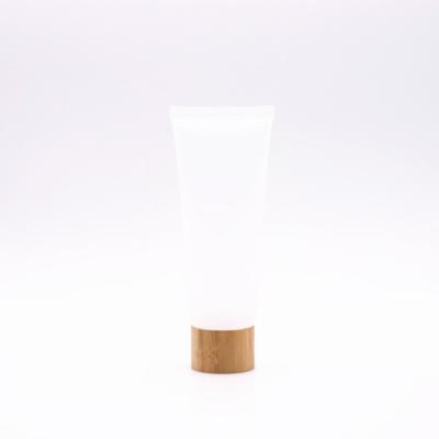 China 50g Custom Good Quality White Cosmetic Skin Care Serum Logo Free Sample Plastic Tube With Wooden Cover for sale