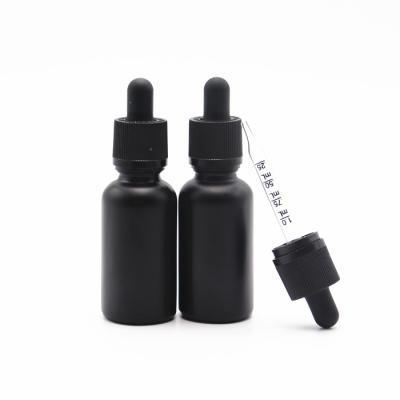 China Cosmetic wholesale matte frosted 30ml cbd oil tincture glass bottle pipette serum dropper black measuring glass bottle for sale