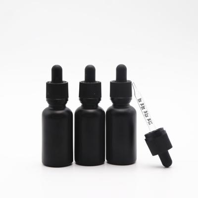 China 30ml black frosted glass bottle cosmetic wholesale cbd liquid oil dropper glass e bottle with measuring plastic child safe pipette for sale