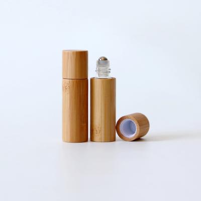 China Custom Bamboo Perfume Bottle Cosmetic Glass Bottles Durable Using Oil 10ml Roller Bottle for sale