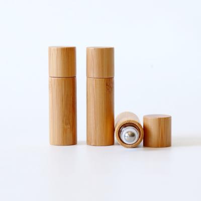 China Custom Bamboo Cosmetic Oil Bottles Glass Bottles Durable Using Essential Oil Roller Bottles for sale