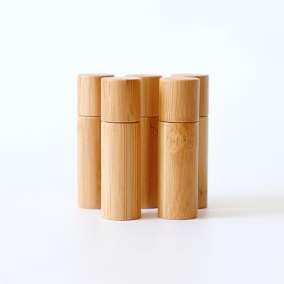 China Custom Bamboo Airless Bottles Cosmetic Durable Bottle Glass Using Airless Bottle With Roller Ball for sale