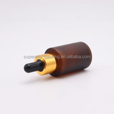 China Wholesale Amber Frosted Cosmetic Glass Dropper Bottle 30ml Shoulder Serum Eye Essential Oil Flat Dropper Bottle With Gold Cap for sale