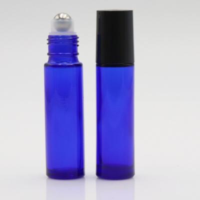 China Mini Round 10ml Blue Glass Essential Oil Cosmetic Bottle Roll On Perfume Bottle 5ml 10ml Glass Roll On Bottle for sale