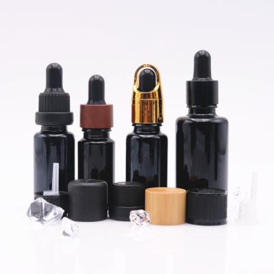 China 10ml 15ml 30ml Cosmetic Glass Bottle Essential Oil Glass Bottle Black Violet Oil Bottle With Dropper for sale