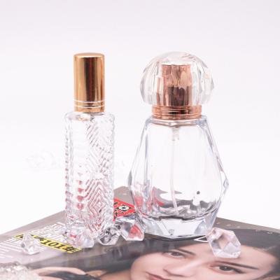 China Cosmetic Luxury Cosmetic Round Bottom Gold Empty Glass Perfume Bottle Pretty Perfume Bottles With Gift Box for sale