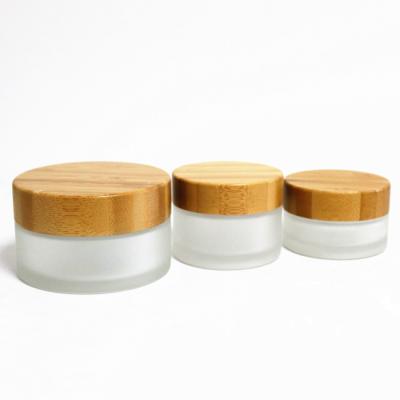 China Wholesale Cosmetic Luxury Cream Jar Transparent Frosted Glass Jar 30ml 50ml 100ml Jar With Bamboo Lid for sale