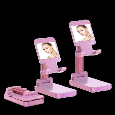 China Hot Selling Plug Folding Desktop Mobile Phone Holder Stand With Mirror for sale