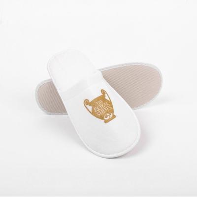 China Wholesale Custom Disposable Hotel Slippers Yellow Logo for sale