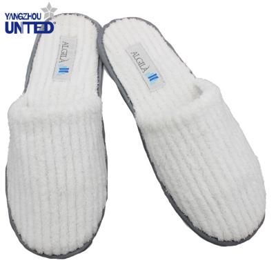 China Custom Made Soft Luxury Warm White Personalized Hotel Slippers Closed Toe Disposable Luxury Hotel Slippers Non-Slip Sole for sale