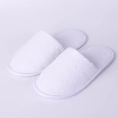 China Washable White Closed Toe Terry Towel Slipper Unisex Travel Spa Hotel Guest Comfortable Soft Anti-skid Bedroom Slippers for sale