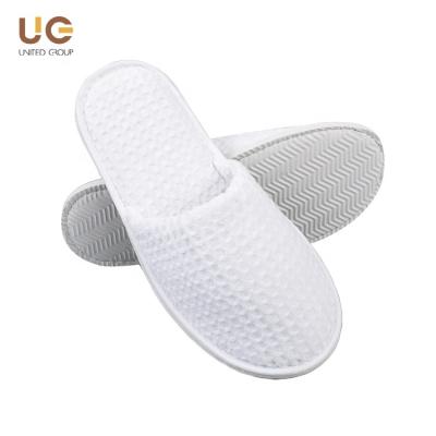 China Exquisite Disposable Hotel Amenities Slippers China Factory Hotel Supplies Disposable Waffle Hotel Slippers Spa Slippers for sale