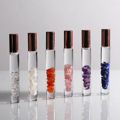 China Custom Crystal Glass Essential Oil Roller Bottle Logo Gemstone Rose Gold Lids 15ML 10ML Personal Care for sale