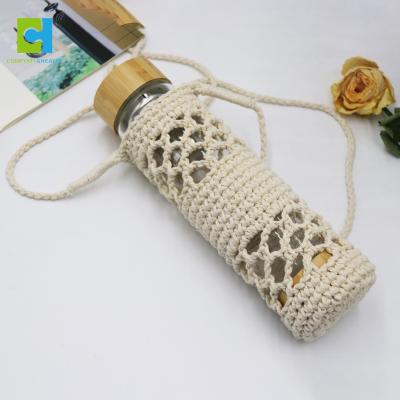 China Custom Handmade Insulated Cotton Rope Weave Crystal Glass Water Bottle Carrier Sleeve Bag With Shoulder Strap for sale