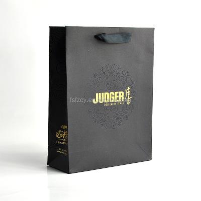 China Recycled Materials Customized Promotional Wholesale Fashion Clothes Cosmetics Packaging Paper Bag for sale