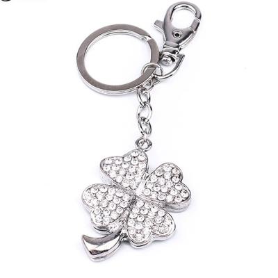 China Cute Lucky Graduation Souvenir Green Sliver Crystal Rhinestone Four Leaf Clover Zinc Alloy Key Chain for sale