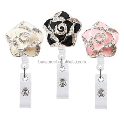 China Handmade Design Crystal Diamond Badge Reel With Belt Flower Bling Business Style Luxury Crystal Flower Office Cut Retractable Badge Ho for sale