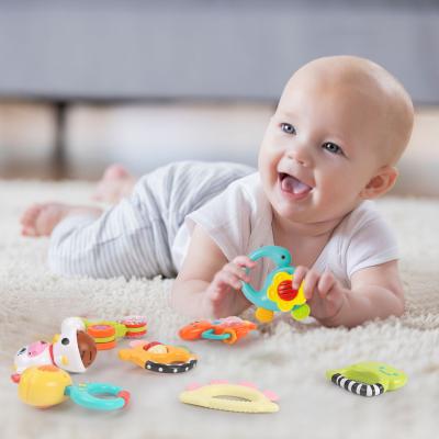 China STUFFED Chew Toy Infant Handbell Set Dinosaur Shape Bell Teething Toy Baby Rattle Silicone Teether for sale