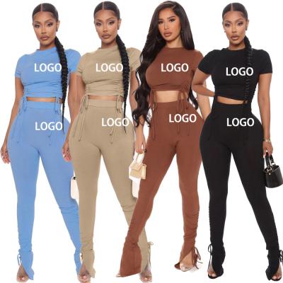 China Breathable Ribbed Tracksuit Set 2 Piece Women Drawstring Long Sleeve Knitted Crop Top Set Open Leg Pant Matching Set for sale