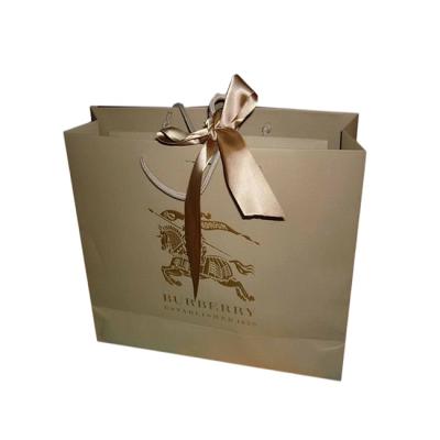 China New Inventions Hot Selling China Shinny Gold Recyclable Gift Paper Bag for sale