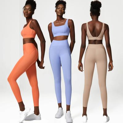 China Breathable Two Piece Sports Bra Sets Women Fitness Gym And High Waist Leggings Solid Color Hot Sale for sale