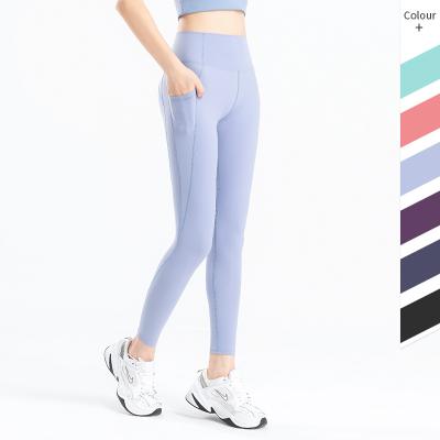 China Breathable Women Yoga Legging With Phone Pockets High Waist Fitness Custom Pants Sweat Wicking Workout Apparel Wholesale for sale