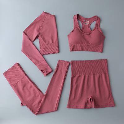 China Women Breathable Four Pieces Yoga Fitness Sets Breathable And All Seasons Best Selling Seamless Sportswear High Waist Running Suits for sale