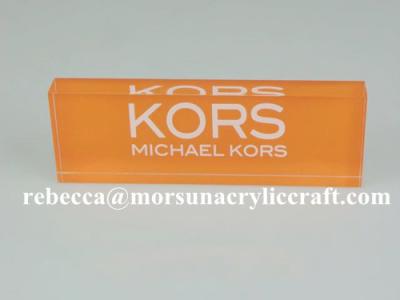 China Transparent Acrylic Brand Block With Orange Background for sale