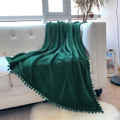 China Anti-Static Flannel Solid Fleece Microfiber Throw Ball Luxury Tassel Blanket With Pompom Tassel for sale