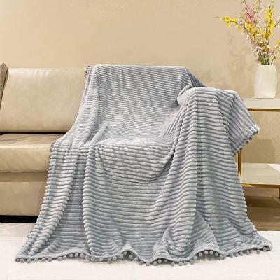 China Anti-Static Solid Luxury Tassel Blanket Ball Microfiber Fleece Cozy Flannel Jacquard Blanket for sale